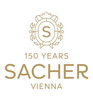 Logo „150 Years Sacher Vienna“ mit stilisiertem Wappen und goldenem Schriftzug auf hellem Hintergrund