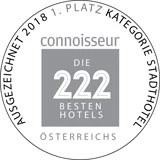 Siegel der Auszeichnung **„Die 222 besten Hotels Österreichs“** von *connoisseur*, mit dem Hinweis **„Ausgezeichnet 2018 – 1. Platz Kategorie Stadthotel“**.