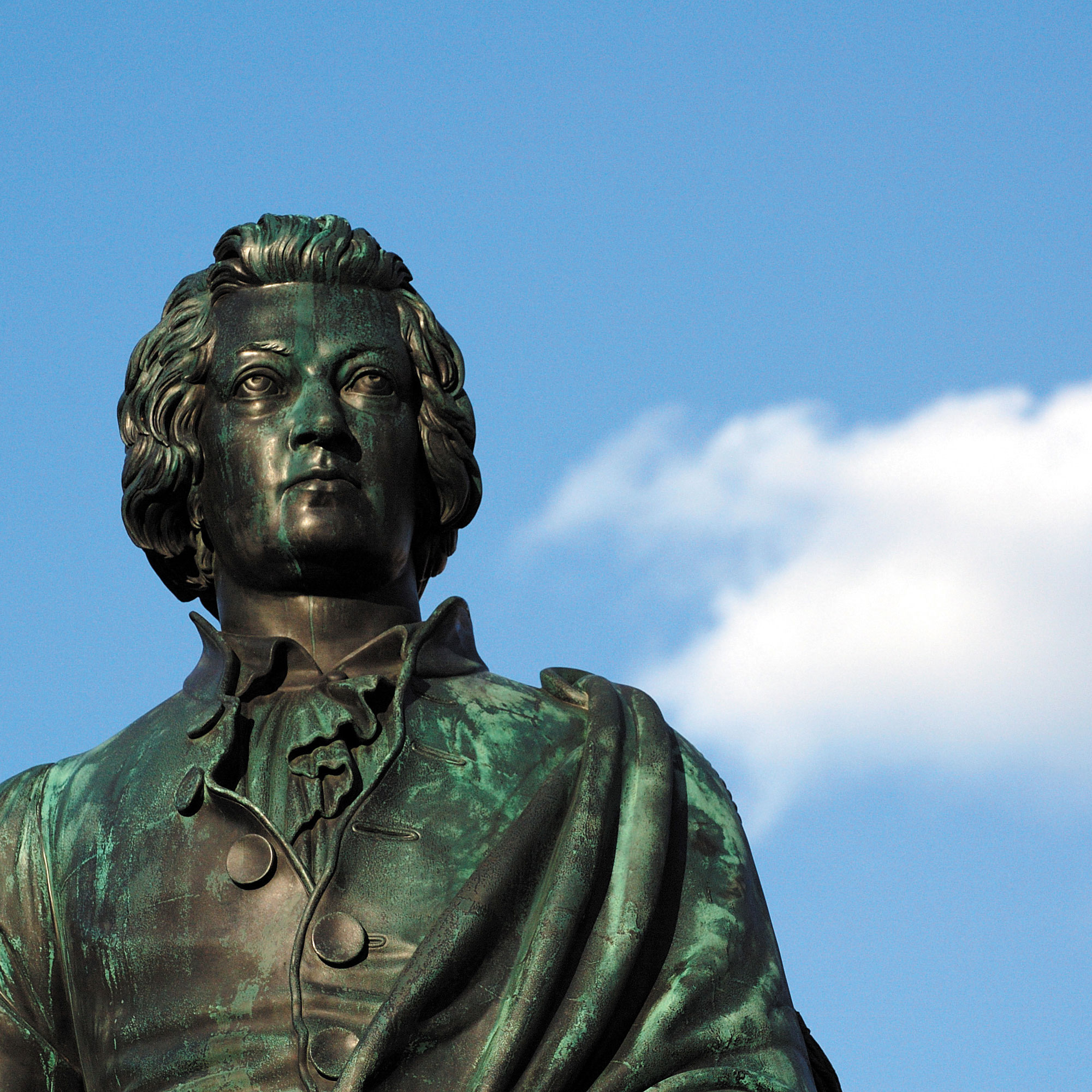 Close up to the heads of the famous Mozart Monument on the Mozartplatz in Salzburg.