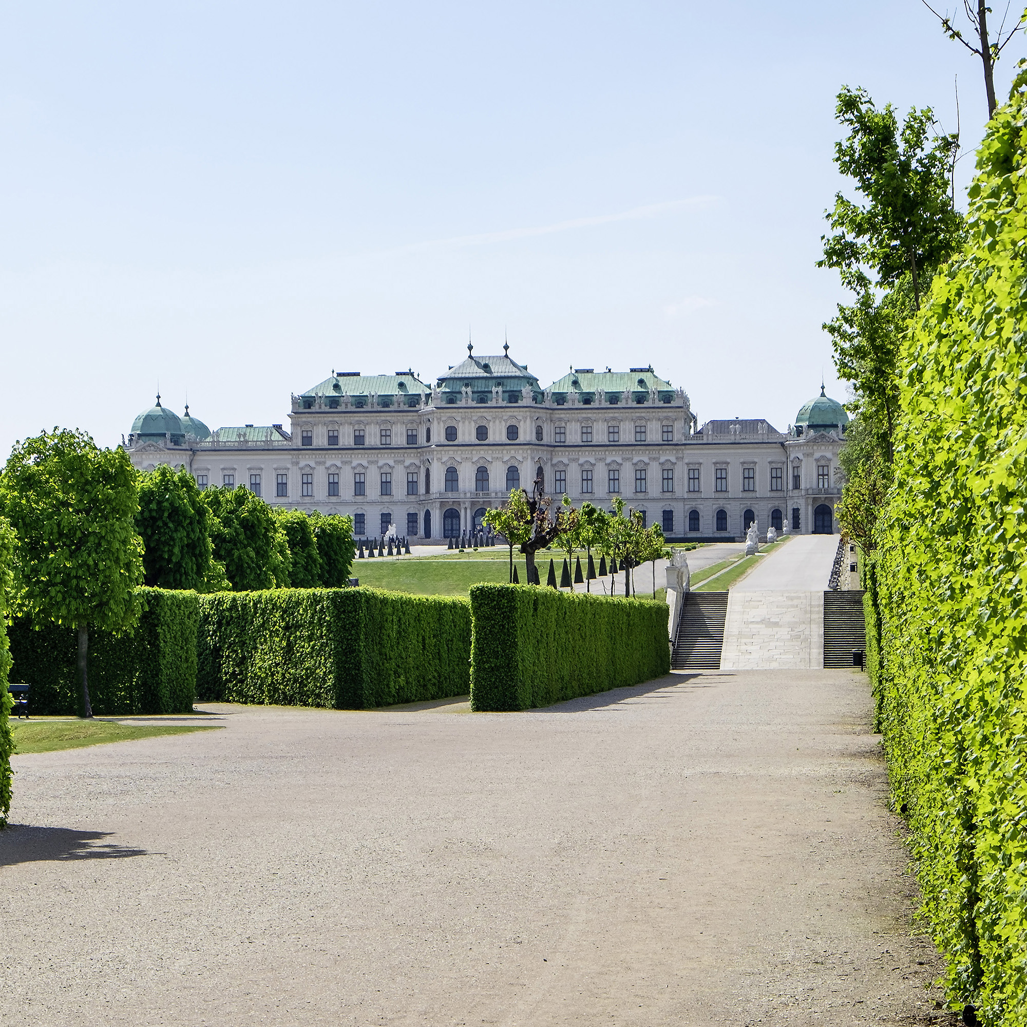 The Upper Belvedere Palace rises elegantly beyond manicured gardens in Vienna.