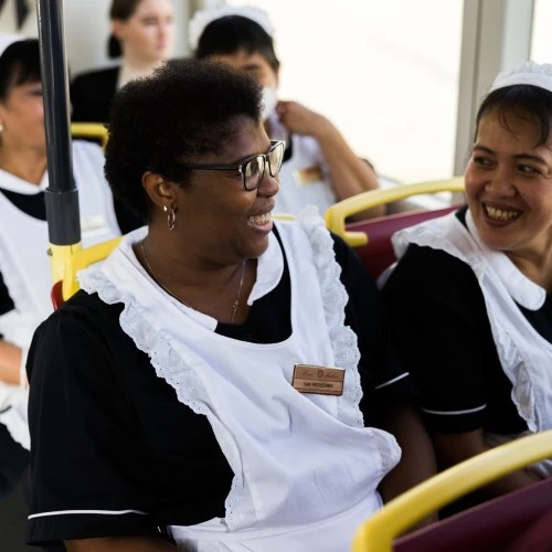 Housekeeping team members from Hotel Sacher enjoying a cheerful moment together — a glimpse of the heart behind the hospitality