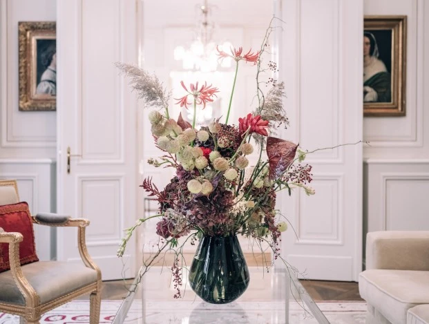 Extravagant flower-assortment on glass table in Madame Butterfly Suite.