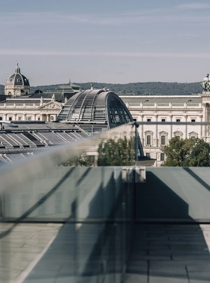 This image captures the terrace from a Signature Suite at Hotel Sacher Wien, offering a stunning view of the surrounding historical architecture.