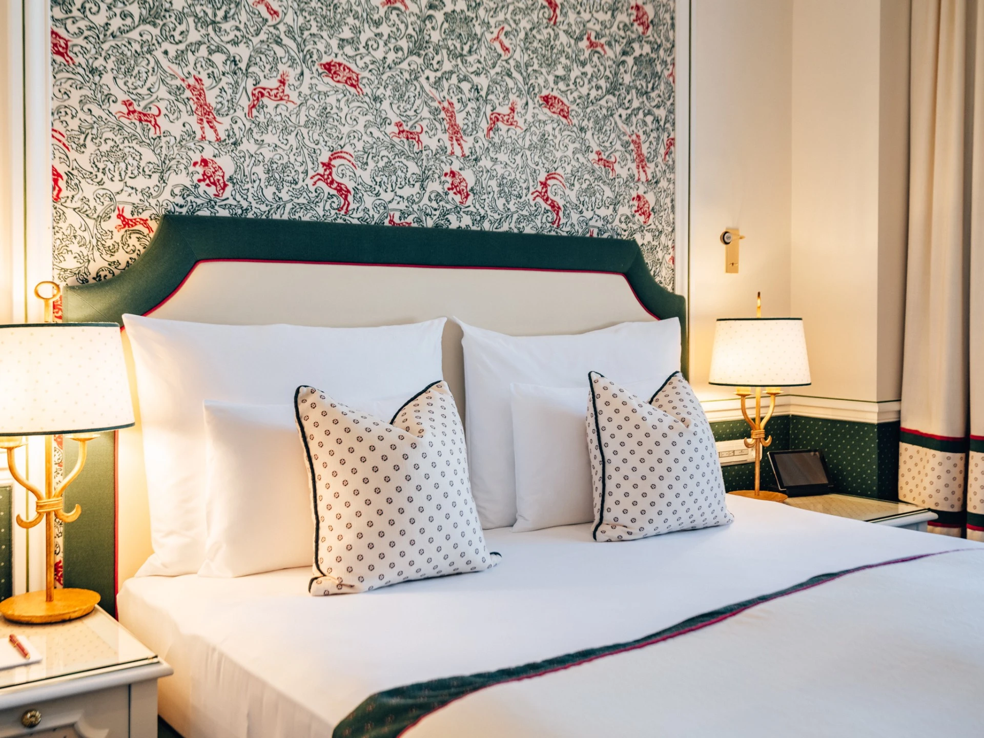 A refined and cozy guestroom at Hotel Sacher Salzburg, featuring elegant textiles, plush bedding, and classic Austrian charm.