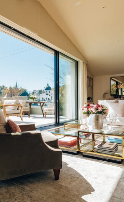 This bright and luxurious living room in the Sacher Sky Suite at Hotel Sacher Salzburg opens up to a private terrace with breathtaking views of the historic Hohensalzburg Fortress and Salzburg’s baroque skyline.