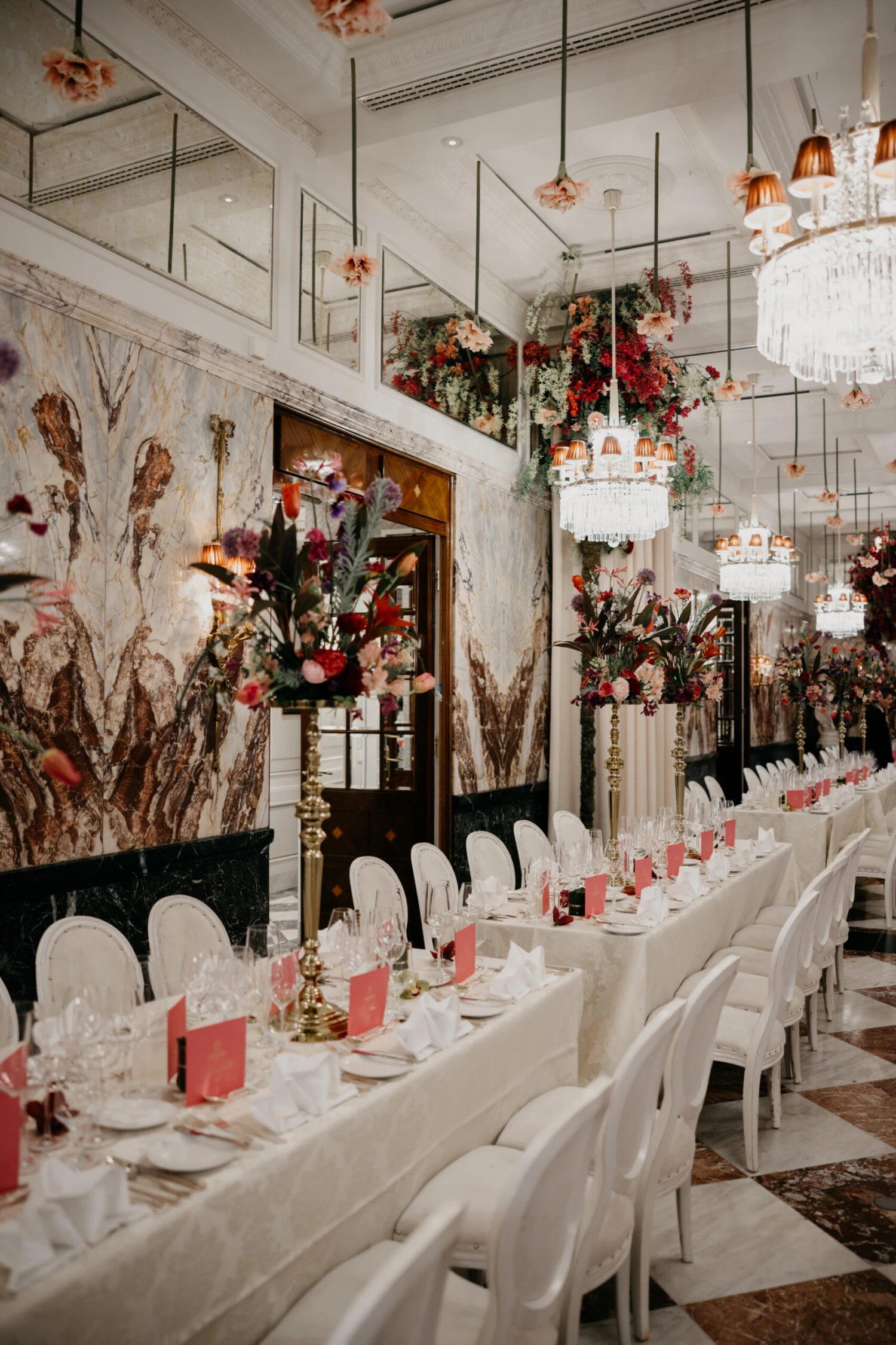 Festively decorated table with floral decorations for the Vienna Opera Ball in an elegant ball atmosphere