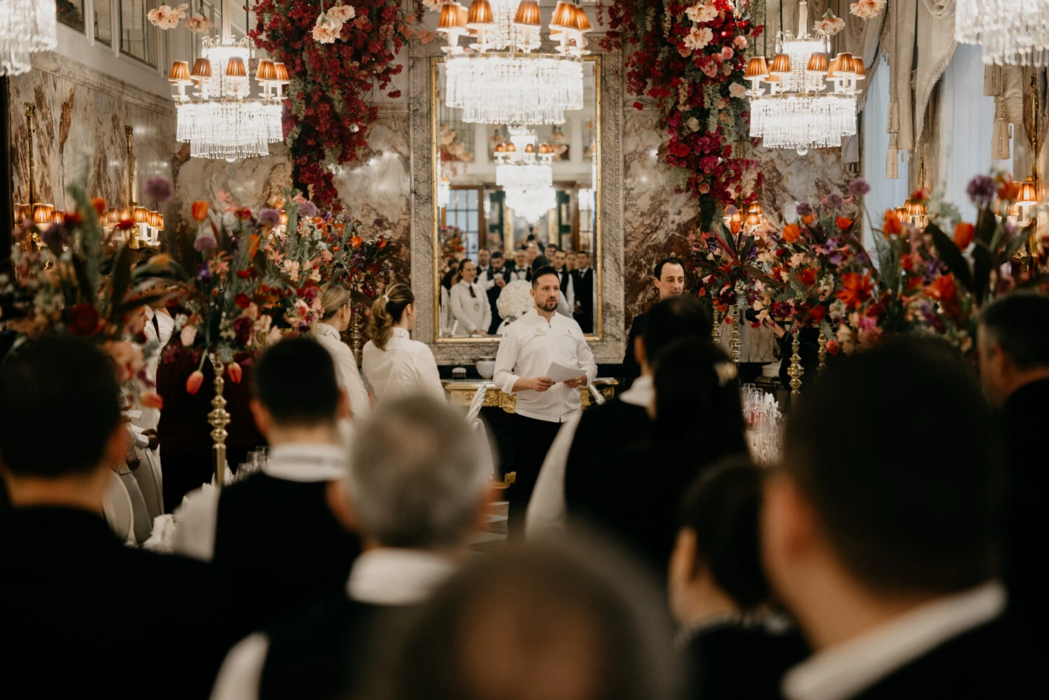 Preparation for the Vienna Opera Ball in the festively decorated interior with service staff and floral decorations