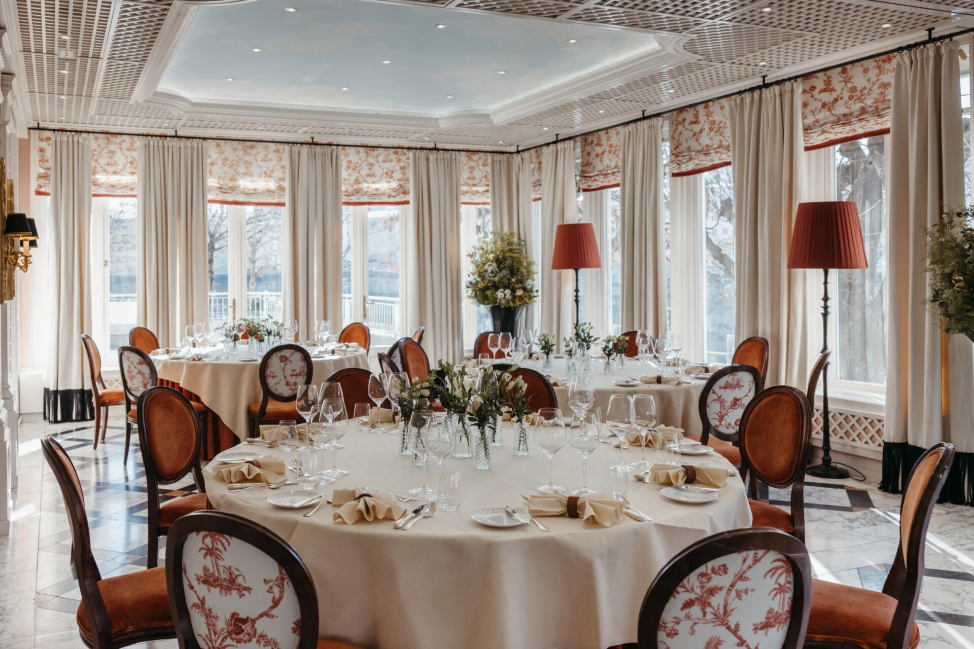 Fine dining table setting at Hotel Sacher Salzburg with wine glasses, folded napkins, silver cutlery and elegant table decor for private events.