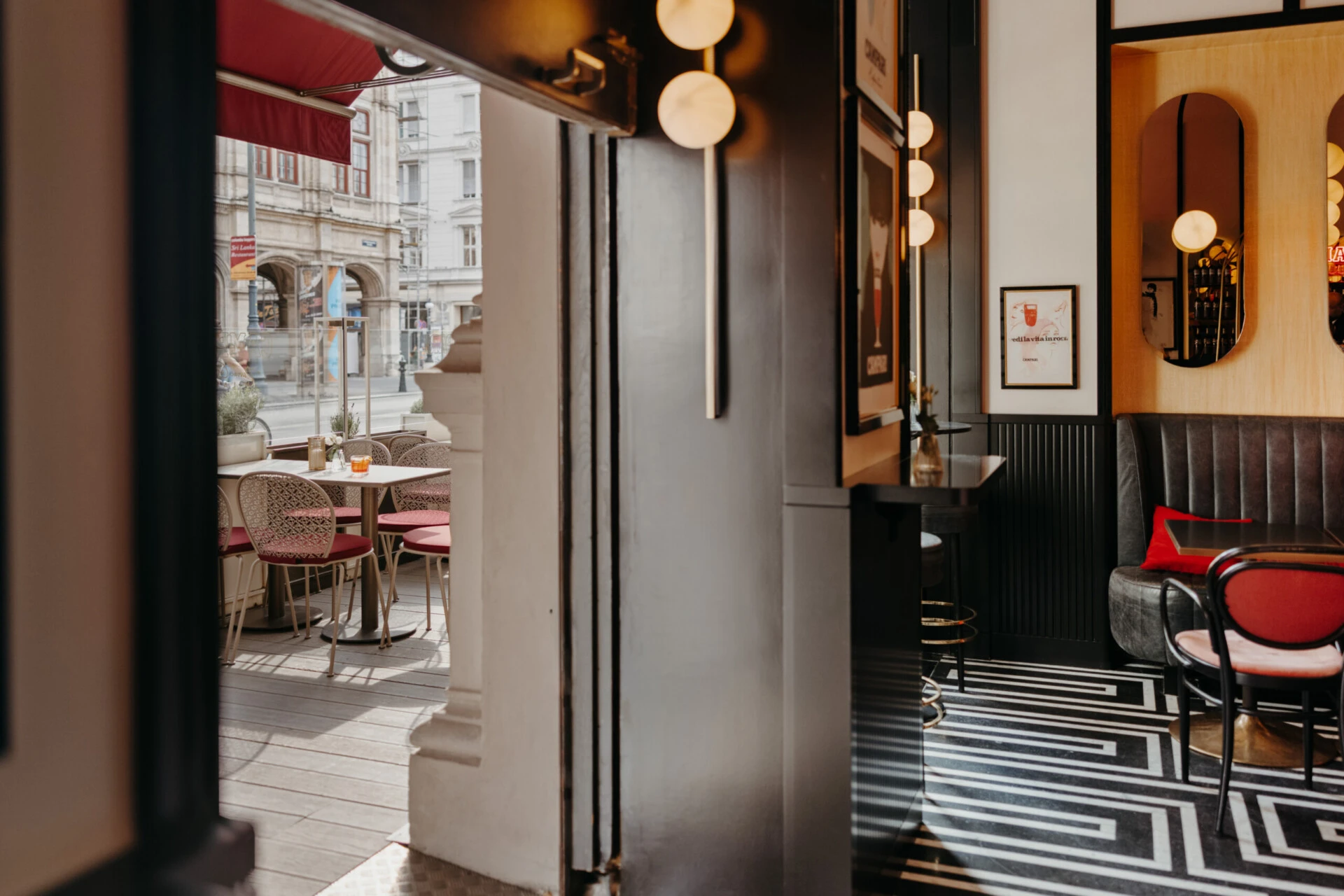 View from Salon Sacher onto the adjoining terrace with outdoor seating.