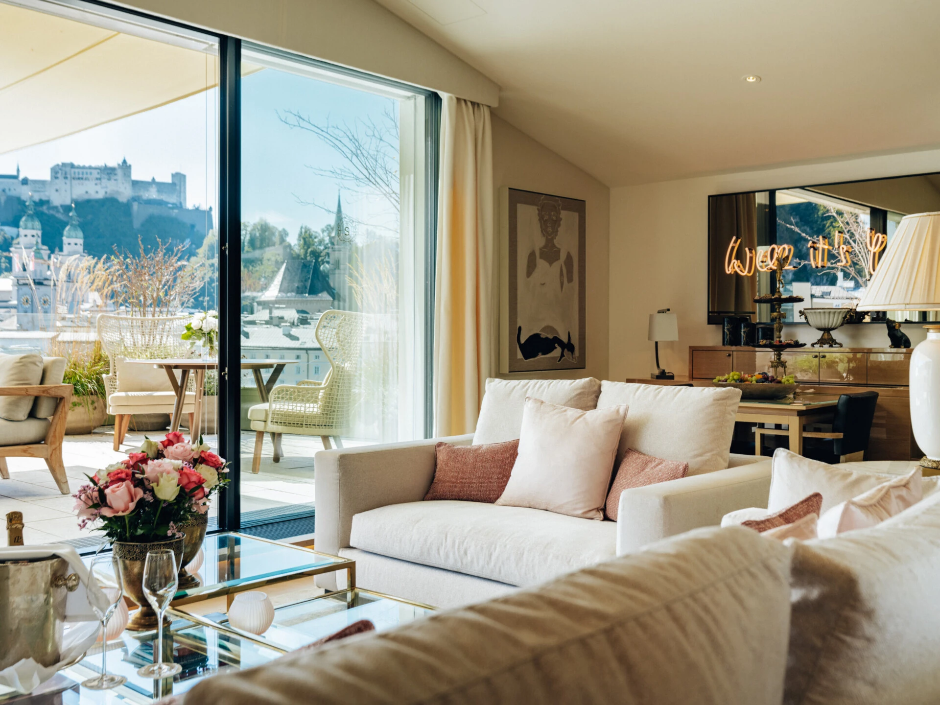 Elegant living area of the Sky Suite with a view of Hohensalzburg Fortress.