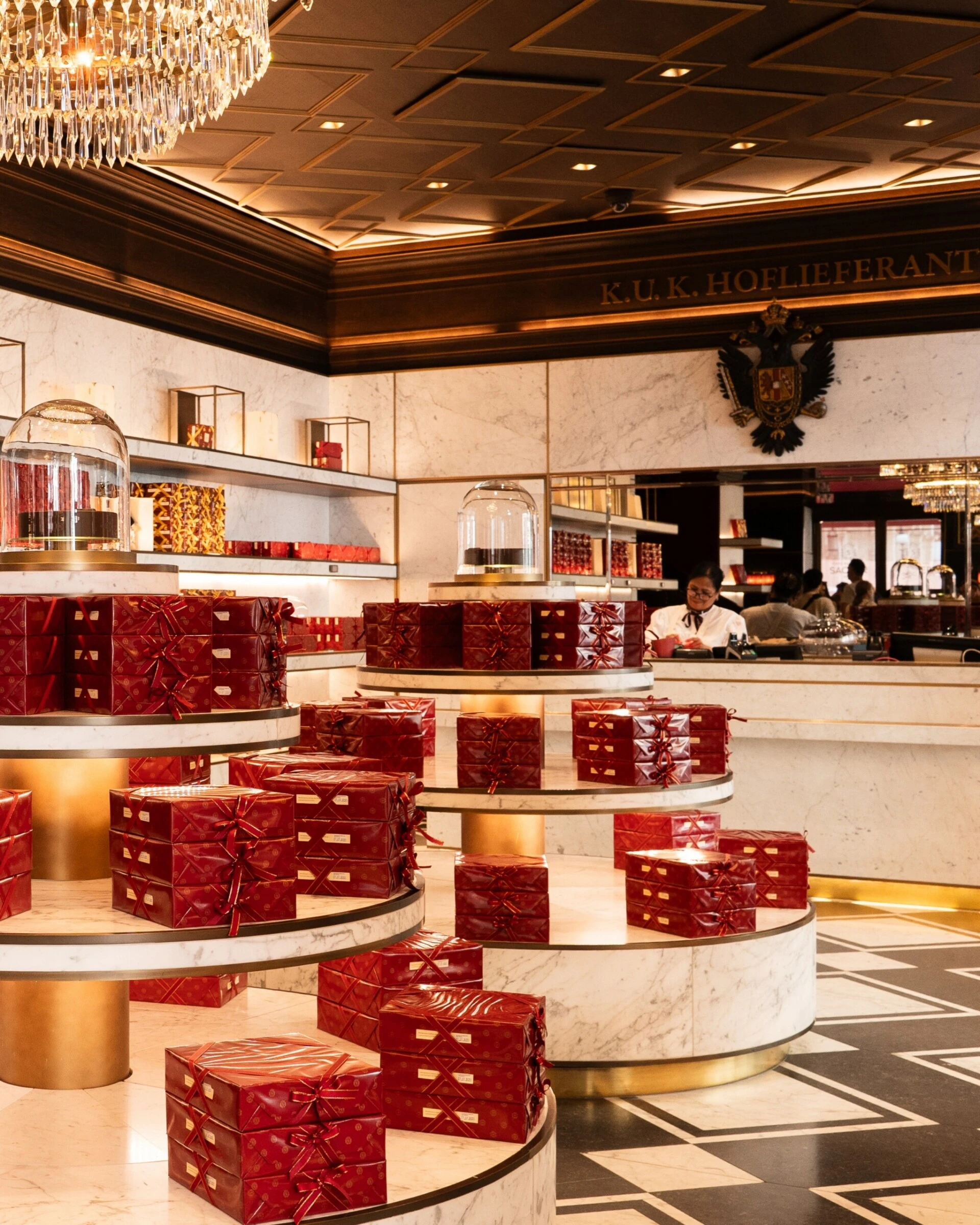 Display of red-packaged Original Sacher-Torte in the stylish confectionery