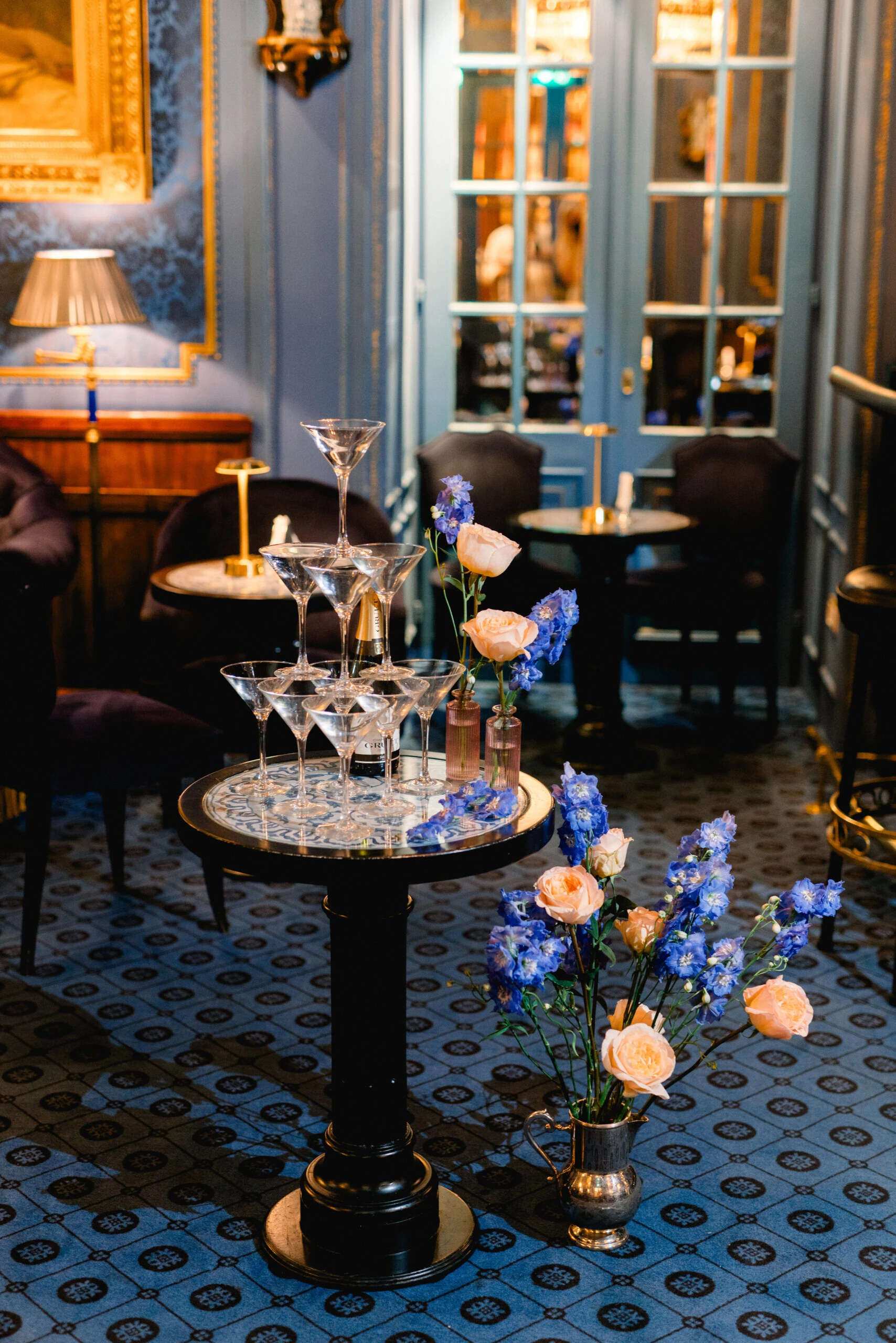 Champagne glasses and floral wedding decorations in the Blaue Bar at the Hotel Sacher Vienna.