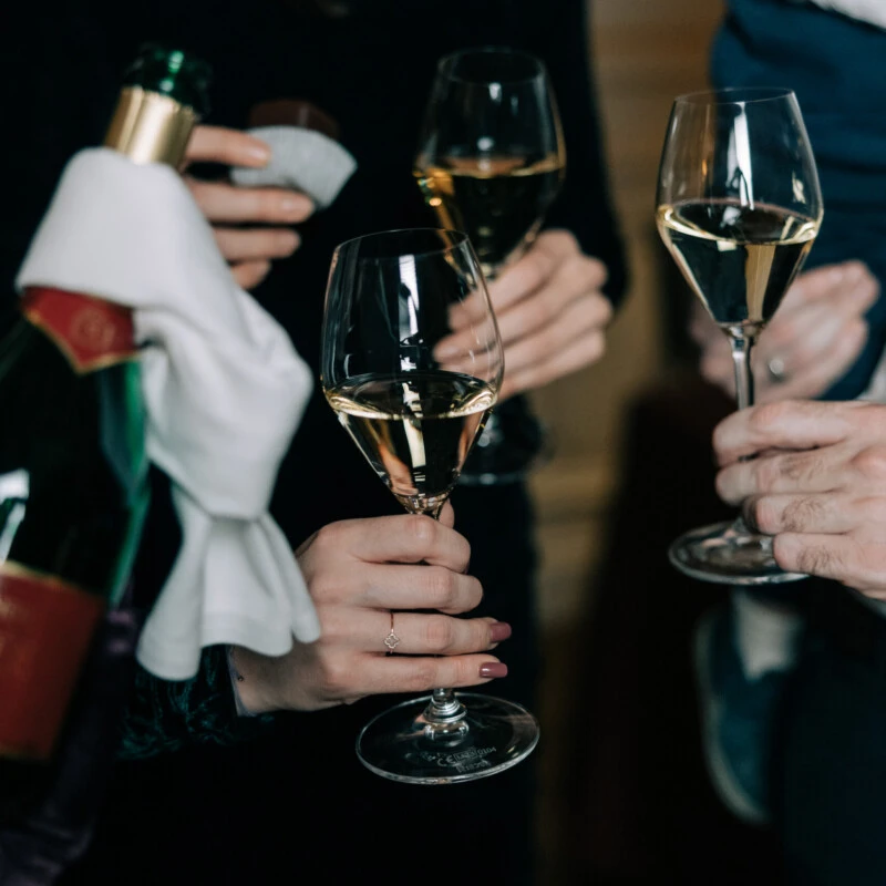 Guests raise glasses of Champagne during a reception at Hotel Sacher.