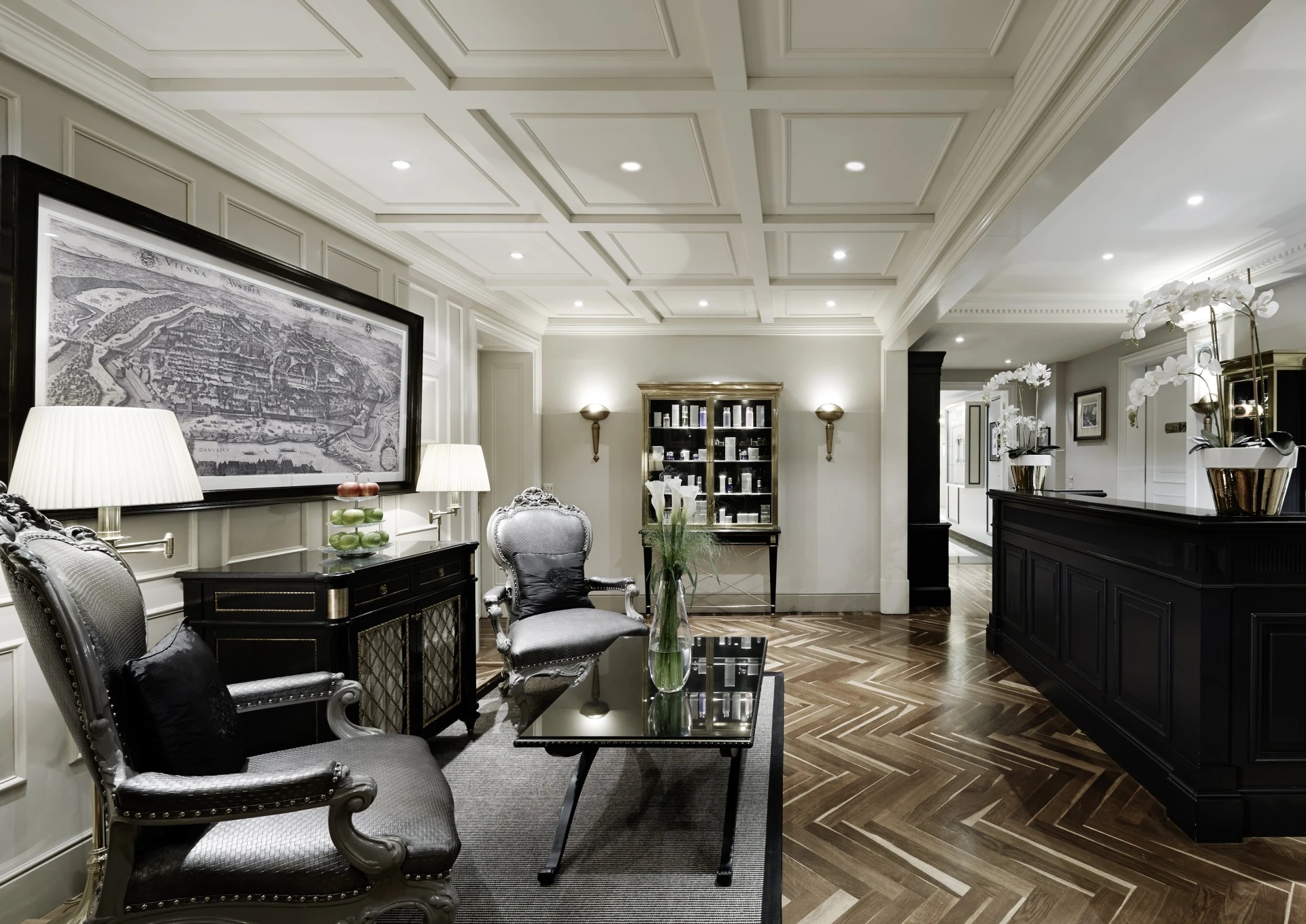 Luxurious spa lounge at Hotel Sacher Vienna with elegant seating, a map artwork, and classic decor.