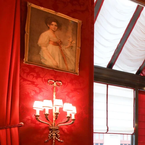 Restaurant Rote Bar is a luxurious dining room in Hotel Sacher, known for its deep red decor and refined ambiance.