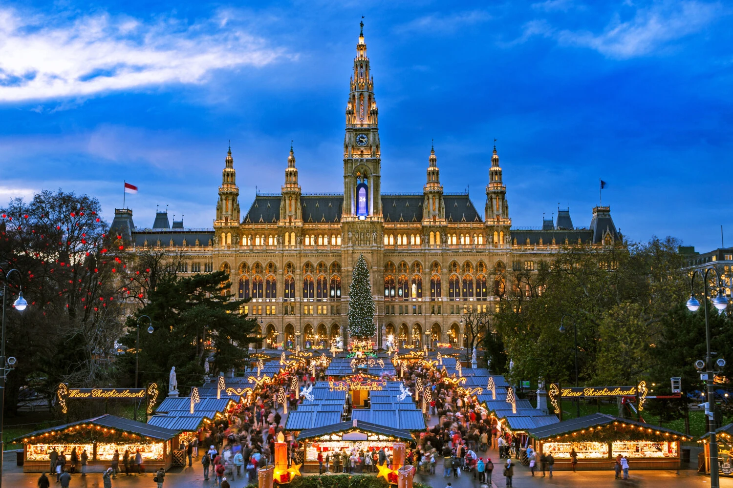 Vienna’s Rathausplatz glows with festive lights during the bustling Christmas market.