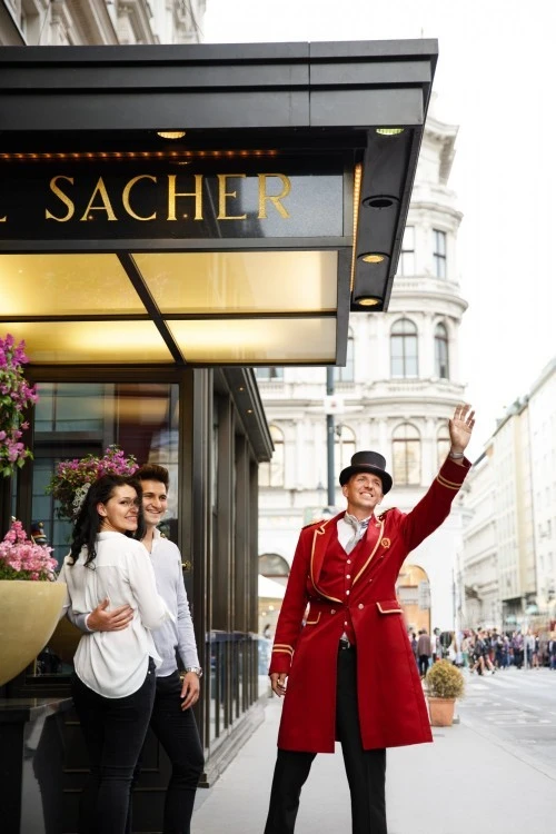 The Wagenmeister at Hotel Sacher is arranging a car for the couple, ensuring their departure is as seamless and elegant as their stay.