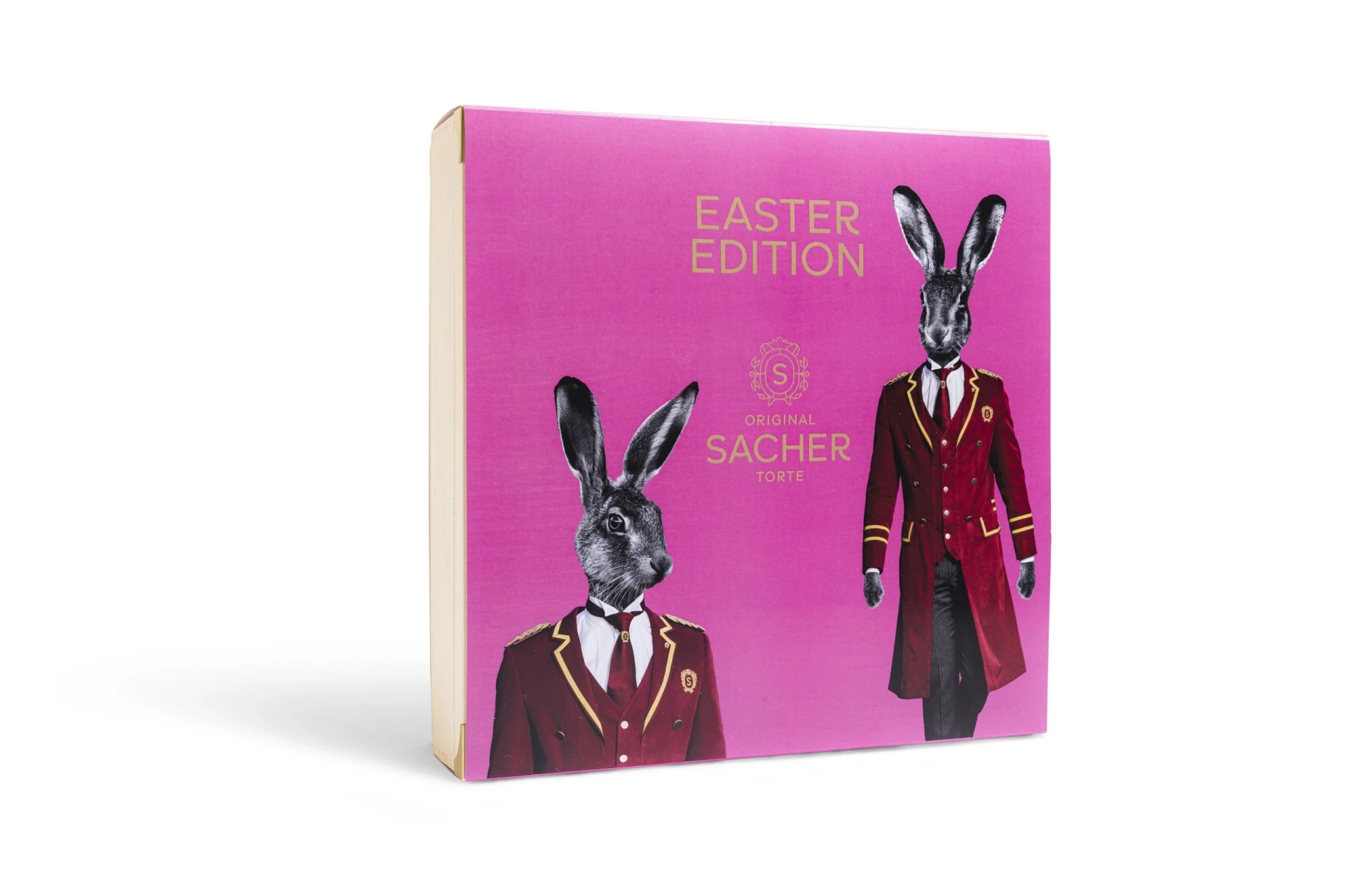 A bold and playful 2022 Easter Edition box of the Original Sacher-Torte, featuring two rabbits dressed in Hotel Sacher uniforms against a vibrant pink background.