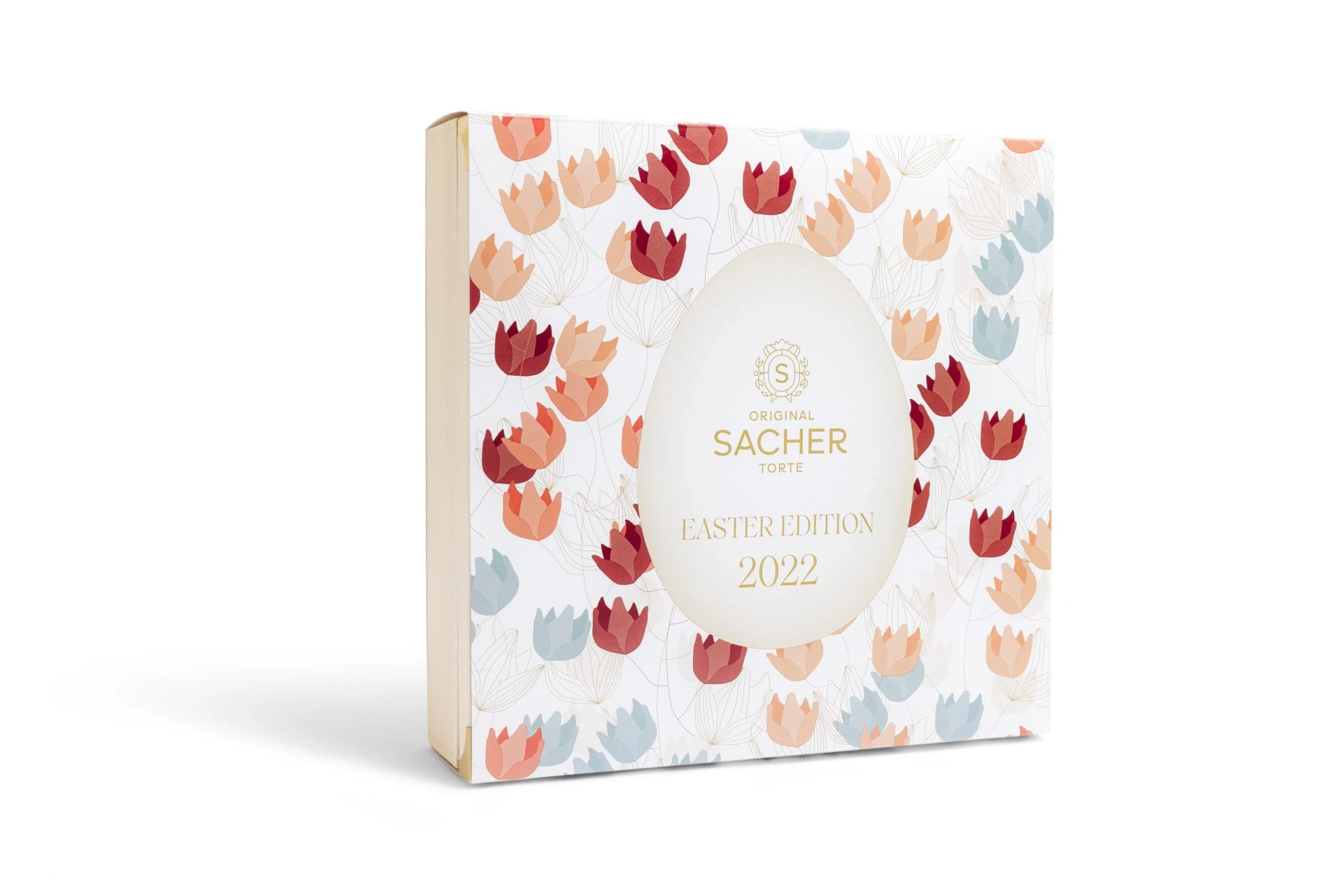 A bright and elegant 2022 Easter Edition box of the Original Sacher-Torte, decorated with a colorful tulip pattern and a central golden egg motif.